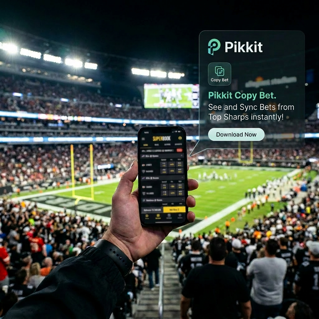 Hand holding smartphone showing live NFL betting odds at football game